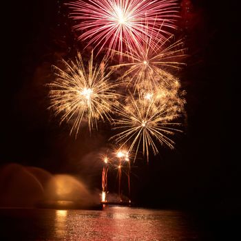 Colorful fireworks on the black sky background