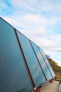 Solar water heating system on the house roof.