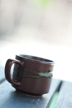 close up view of coffe cup on color back