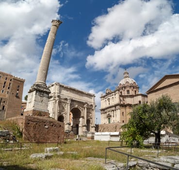 ROME, ITALY - SEPTEMBER 24, 2015 : View of ancient Roman Forum in Rome, on cloudy blue sky background.