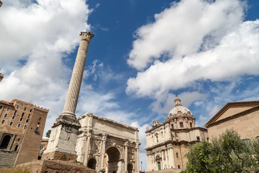 ROME, ITALY - SEPTEMBER 24, 2015 : View of ancient Roman Forum in Rome, on cloudy blue sky background.