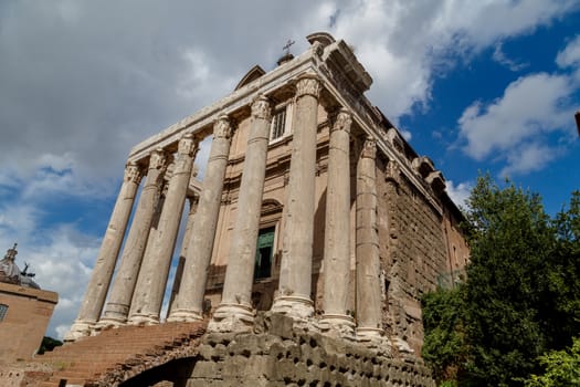 View of the ancient church at Roman Forum, on cloudy blue sky background.