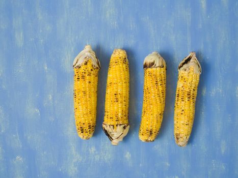 close up of rustic grilled golden corn cob