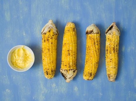 close up of rustic grilled golden corn cob