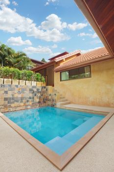 panoramic view of nice summer house patio with swimming pool