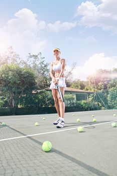 view of female  tennis player on  color back