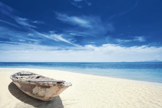 View of nice tropical  beach  with old boat