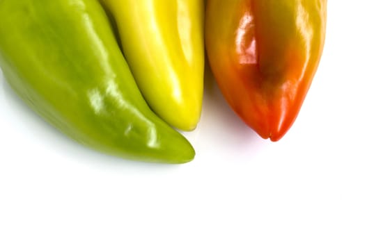 Three colorful bell peppers, isolated on white