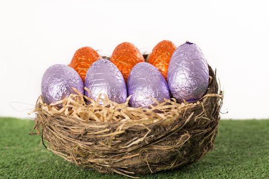 Group of colorful candy Easter eggs wrapped in foil 