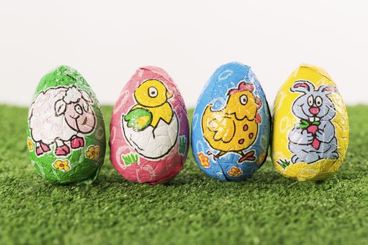 Group of colorful candy Easter eggs wrapped in foil 