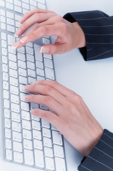 close up  view of female hands touching computer keyboard