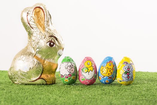 Group of colorful candy Easter eggs wrapped in foil 