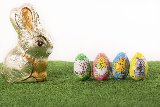 Group of colorful candy Easter eggs wrapped in foil 