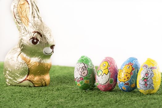 Group of colorful candy Easter eggs wrapped in foil 