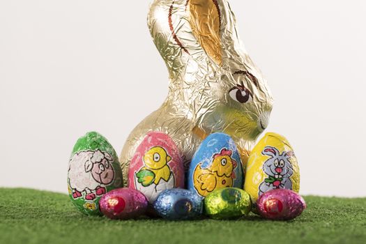 Group of colorful candy Easter eggs wrapped in foil 