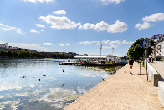 Copenhagen, Denmark - August 05, 2015 : the lakes in Copenhagen, Denmark is a row of 3 rectangular lakes curving around the western margin of the City centre, forming one the oldest and most distinctive features of the city's topography. The paths around them are popular with strollers and runners. Copenhagen, Denmark.