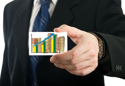 Businessman showing card with stack of euro coins and prediction chart