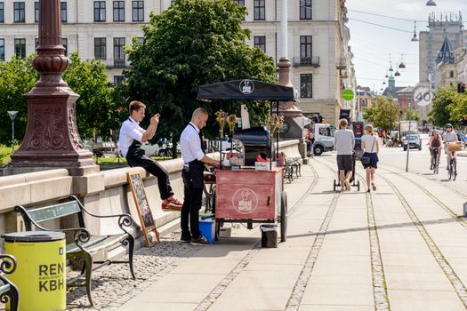 Copenhagen, Denmark - August 05, 2015 :  Italian Cafe in Copenhagen, two young barman sell Italian cafe along the bridge Dronning Louises Bro. Copenhagen, Denmark.