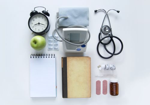 Medical objects laid out on a white table