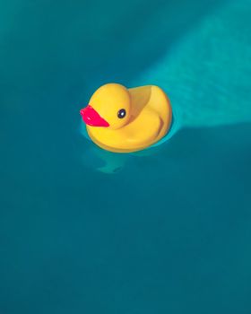 Rubber Ducky floating in deep blue water.