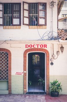 A doctors in Mexico with clear signage and an open door