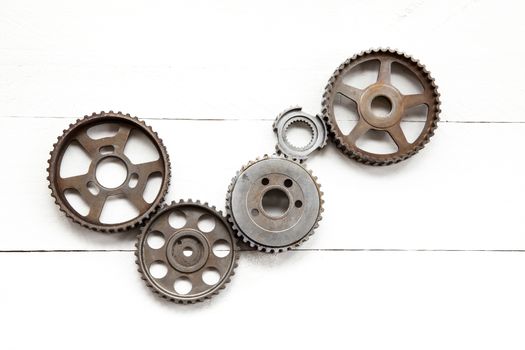 Cogwheels machinery , engineering and industry or concepts such as teamwork and search engine on white background