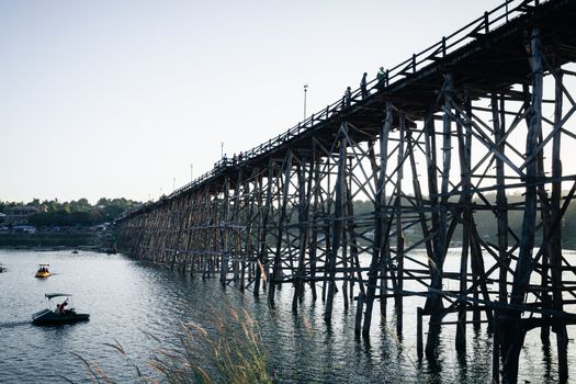 Utamanusorn Bridge (Mon Bridge), made from wooden for across the river in Sangkhlaburi District, Kanchanaburi Thailand