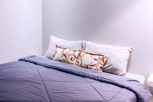 two pillows on bedroom with blanket