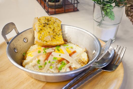 egg pan with pork and bread for breakfast, tradition Thai style