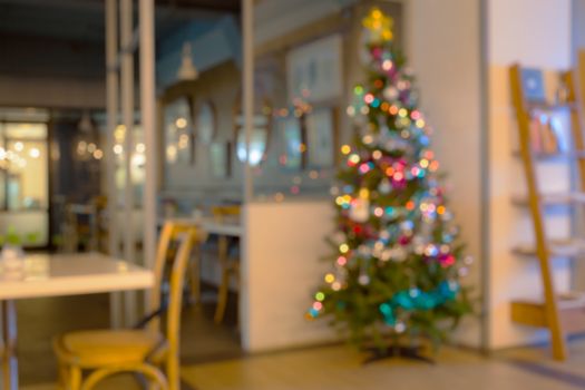 Table and Chair with Christmas tree in living room,blur background