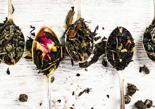 Leaf tea of different varieties in spoons.Top view