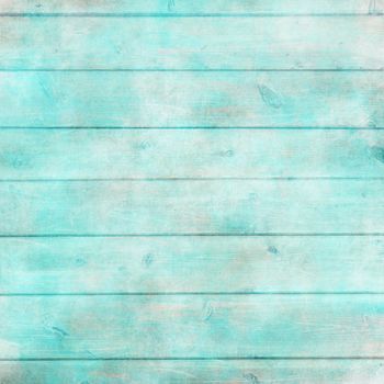 Rustic old plank background in turquoise, mint and beige colors with textured scratches and antique cracked paint for scrapbooking and decoupage
