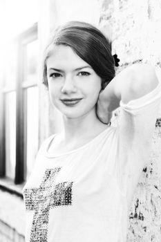 charming girl teen posing outdoors in bright sunlight