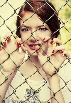 charming girl teen posing outdoors in bright sunlight