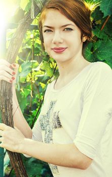 charming girl teen posing outdoors in bright sunlight