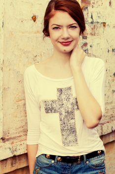 charming girl teen posing outdoors in bright sunlight