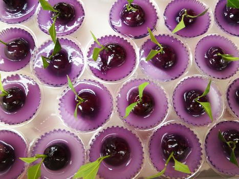 Thai Sweet Bean Confections plating in Purple Coconut Sweet Pudding Jelly (Thai Dessert of Kanom Look Choup nai Wun Kati)