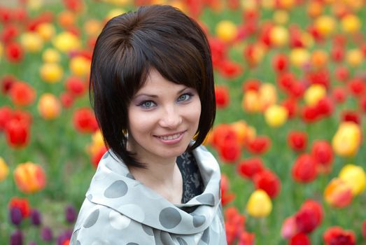 Pretty girl with tulips with soft background