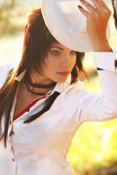 Beautiful girl in the white hat- soft background portrait