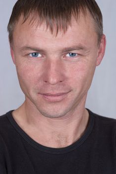 Handsome young man close up portrait on white background