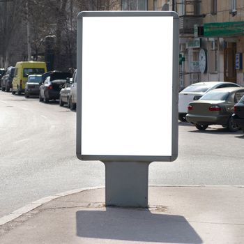 Vertical blank billboard on the city street