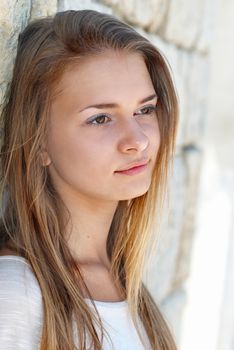 Beautiful blond girl outdoors against the sea