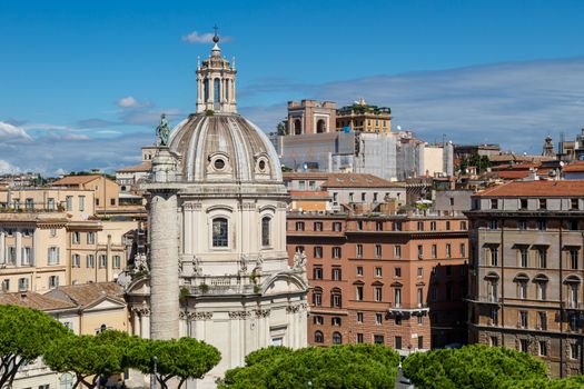Close up view of ancient historical city of Rome with mausoleum and church dome, on cloudy blue sky background.