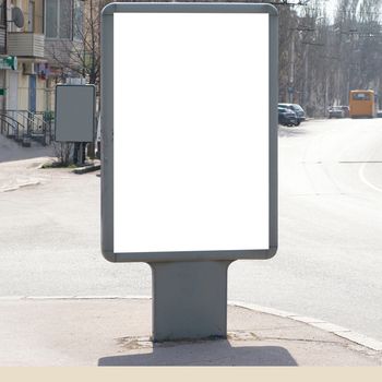 Vertical blank billboard on the city street