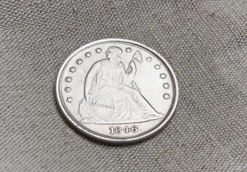 Old silver coin of the USA over sack