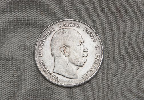 Old silver five mark of Germany over sack