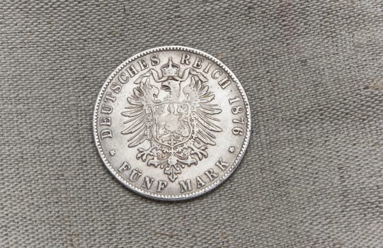 Old silver German reich five mark on sack