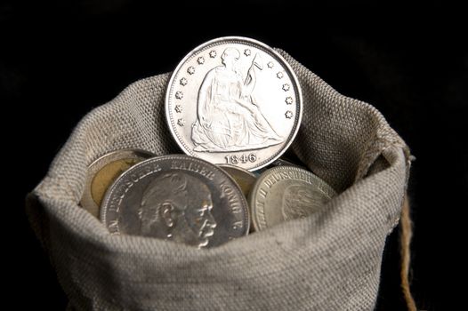 Old silver one dollar coin of USA isolated on black