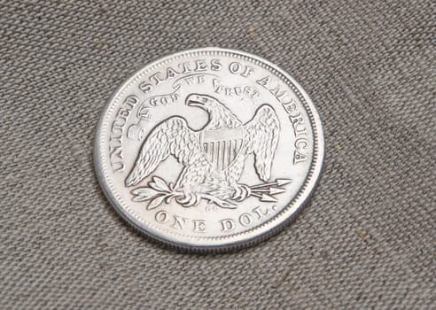 Old silver one dollar coin of the USA