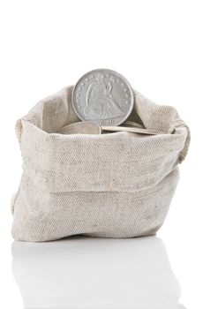 Old silver coins in sack bag isolated on white